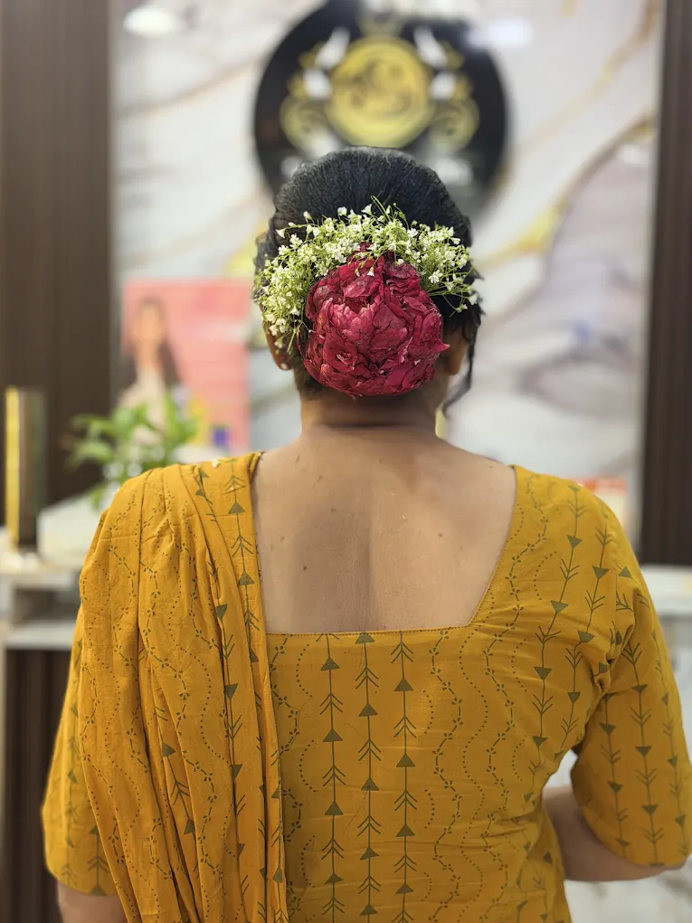 Bridal hairstyle finished with fresh flowers