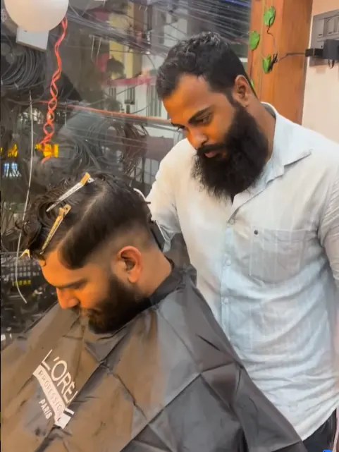 Men's haircut in progress at Shape Shifters